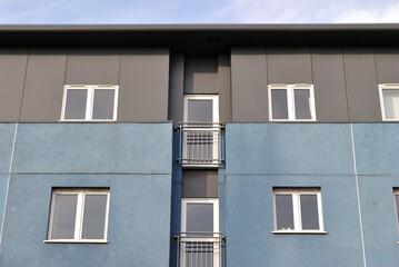 Fototapeta na wymiar Facade of Modern Apartment Building seen from Below
