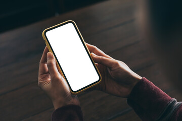 cell phone blank white screen mockup.woman hand holding texting using mobile on desk at office.background empty space for advertise.work people contact marketing business,technology