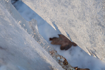 .Close-up pieces of ice texture on the forest in winter time at Bucharest..