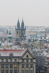 Fototapeta premium Historical center of Prague covered in the first snow of the winter.
