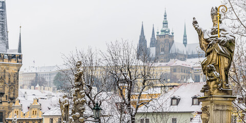 Historical center of Prague covered in the first snow of the winter.