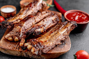 grilled pork ribs on a stone background