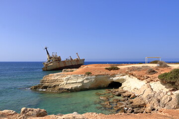 Shipwreck of the abandoned ship Edro III on a rocky coast at Akrotiri Beach in Cyprus
