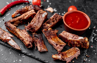 grilled pork ribs on a stone background