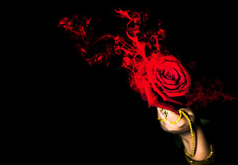 Red rose with abstract fire smoke on black background