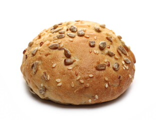 Round bread loaf, bun with mixed seeds isolated on white background