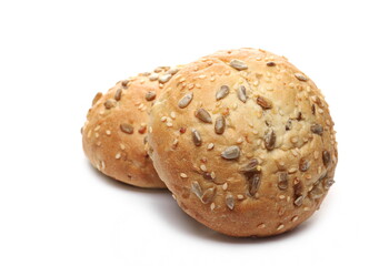 Round bread loafs, buns with mixed seeds isolated on white background