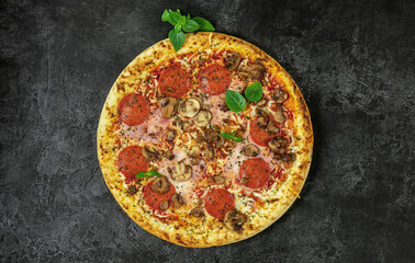 Whole neapolitan pizza served on dark board