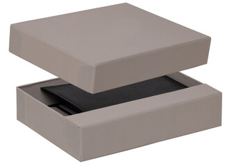 Naklejka premium Closeup of a new black genuine leather wallet for banknotes and plastic cards in a opened gray gift box isolated on a white background. Financial and business concept. Macro.