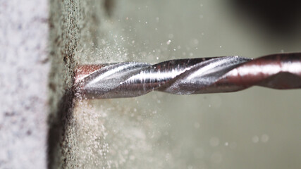 Detail of drill making hole into concere wall