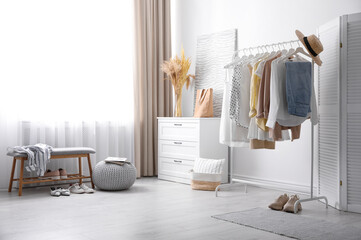 Dressing room interior with stylish white furniture