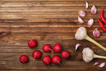 juicy radish and spicy garlic on a wooden table