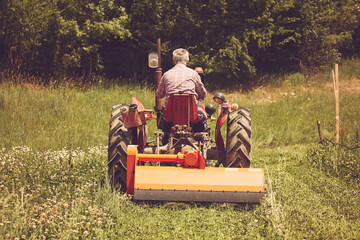 Farmer driving tractor on field.  Agriculture concept. © Kitja