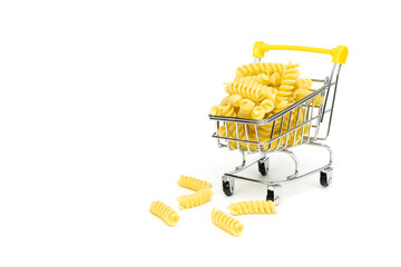 Durum wheat italian pasta in the shopping trolley. Buy and sale of grocery products concept.