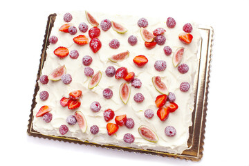 meringue cake with whipped cream and berries - strawberries, raspberries, figs on white