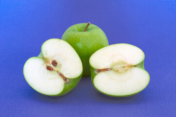 green apple on blue background