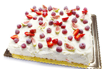 meringue cake with whipped cream and berries - strawberries, raspberries, figs on white