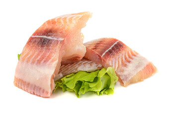 Pangasius fish fillet, pieces on a green lettuce leaf. Isolated on a white background. Fresh Fish Fillet.