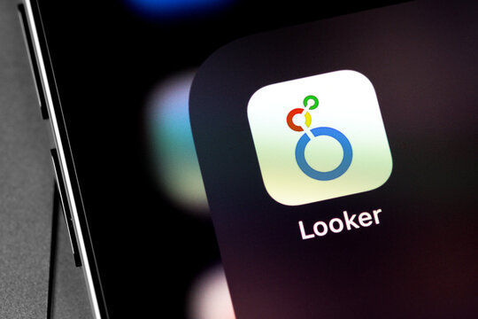 Google Looker app on the screen smartphone. Google Cloud Looker is a business intelligence software and big data analytics platform. Moscow, Russia - December 5, 2020