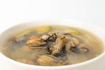 Oyster soup on white background