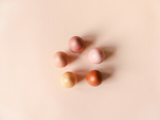 Set of Easter eggs varios colored on beige background