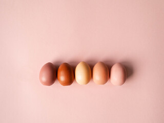 Set of Easter eggs varios colored on pink background