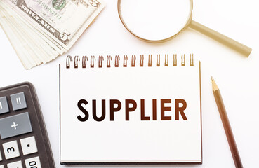 SUPPLIER - text written on a notebook with office background.