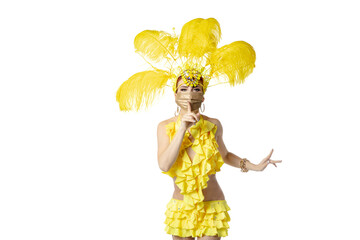 Secret. Beautiful young woman in carnival masquerade costume with feathers and golden face mask dancing on white background. Concept of holidays celebration, festive time, dance, party. Copyspace