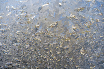Frozen and frost-covered condensation on the glass