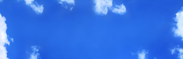 long blue sky with clouds. background for inscriptions high up