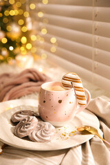 Composition with cup of hot drink on windowsill