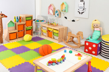 Cute child's room interior with toys and modern furniture