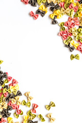 Frame of pasta - flay lay of Italian colorful farfalle, top view