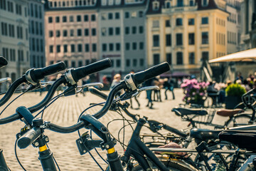 Travel concept photo of rental bikes at Neustadt Square in Dresden. Closeup sharp details of bike...