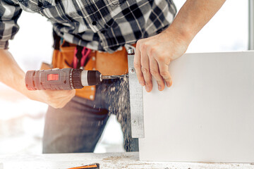 Man working during process of furniture manufacturing