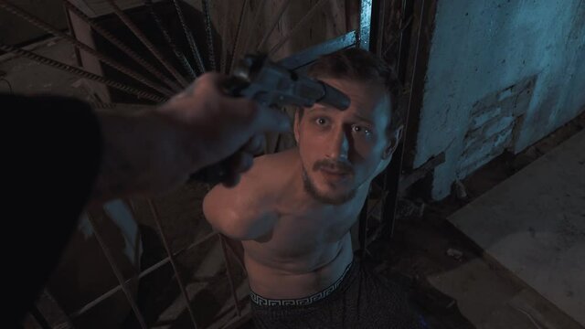 Scared man. USSR victim. Russian man with gun