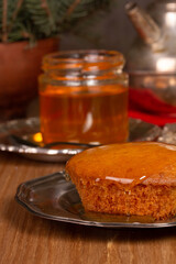 Homemade fresh biscuit with honey on a plate
