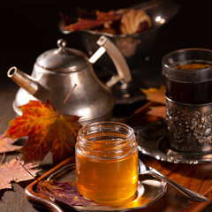 Tea and cookies in vintage utensils on a gray background