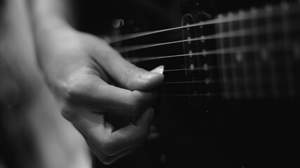 hand holding guitar