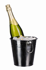 a bottle of chilled sparkling champagne with water drops and ice cubes in a metal bucket on a white isolated background