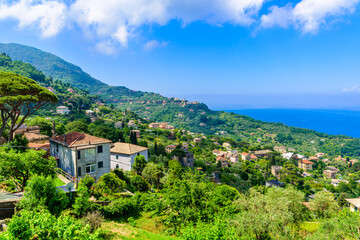 Camogli town in Liguria, Italy. Scenic Mediterranean riviera coast. Historical Old Town Camogli with colorful houses and sand beach at beautiful coast of Italy.