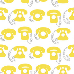 Seamless pattern with vintage yellow telephones on white background.