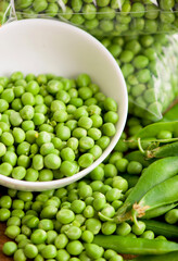 fresh green pea in bowl on wooden background