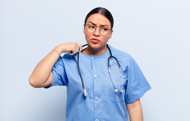 hispanic woman feeling stressed, anxious, tired and frustrated, pulling shirt neck, looking...
