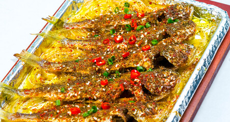 Asian cuisine seafood chili grilled small yellow croaker