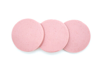 Sliced sausage isolated on white background. Fresh cut boiled pieces. Three slices. Top view.