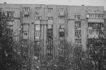 Block in Bucharest in the cold season, snow in Bucharest, black and white photography.