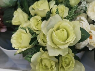 Soft green Rose Beautiful Artificial bouquet flowers decoration ornamental background in vintage classic tone color for greeting card or celebration event, fabric and plastic, Valentine Day, love