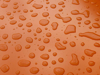 Raindrops on a flat orange surface