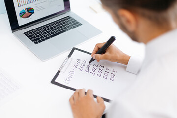 businessman reflecting on the problems after the pandemic .